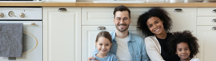 Family sitting next to a new kitchen wall