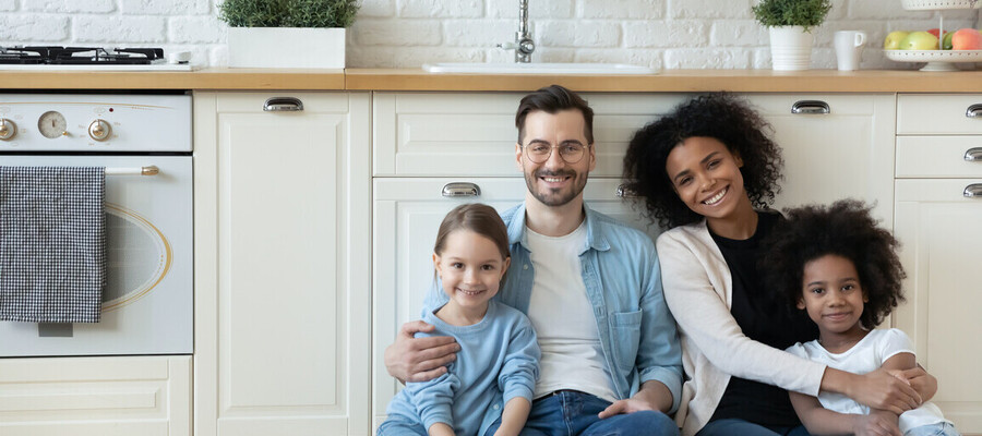 Family sitting next to a new kitchen wall